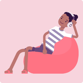 Girl sitting on a beanbag chair, having a phone conversation with someone