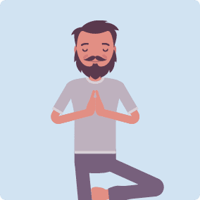 Man is shown, doing a yoga pose standing up, looking happy and peaceful. 