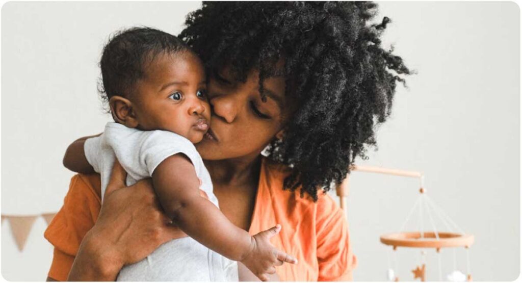 Mom and baby hugging and kissing